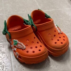 CROCS Kids Orange Sandals with Green Details